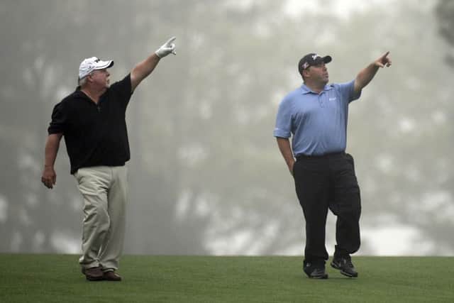Craig Stadler and his son Kevin make their point as they walk up a fairway during a practice round. Picture: Getty