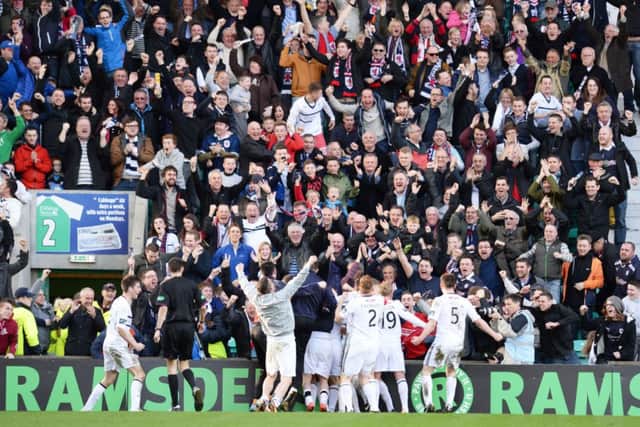 The Raith fans and players celebrate John Baird's winner. Picture: SNS