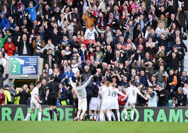 The Raith fans and players celebrate John Baird's winner. Picture: SNS