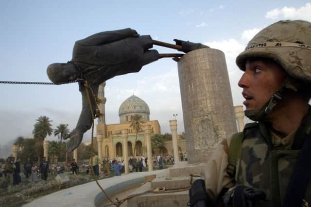 On this day in 2003, US forces took the Iraqi capital Baghdad and a statue of former leader Saddam Hussein was torn down. Picture: Reuters