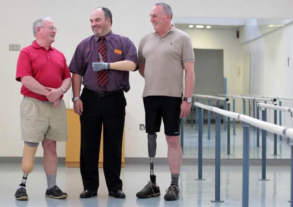 Amputees Jeff Ward (L), Ian Robin (C) and Anthony Stickland (R) at the national prosthetics service at Glasgow's Southern General. Picture: HeMedia