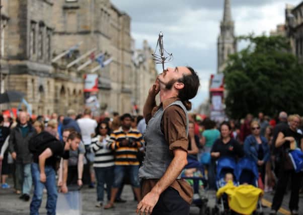 A street performer on the Royal Mile during the 2013 Edinburgh Fringe. Picture: Jane Barlow