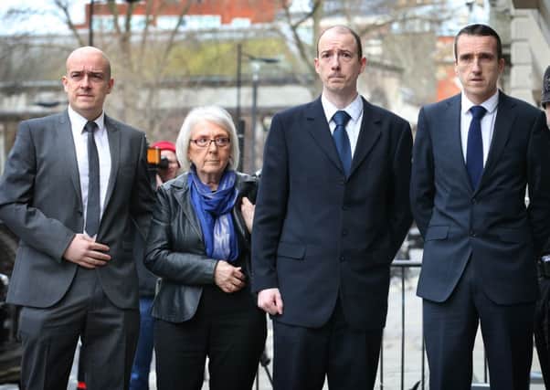 Keith Blakelock's sons Lee, Kevin and Mark stand with their mother Elizabeth Johnson at the Old Bailey. File Picture: Getty