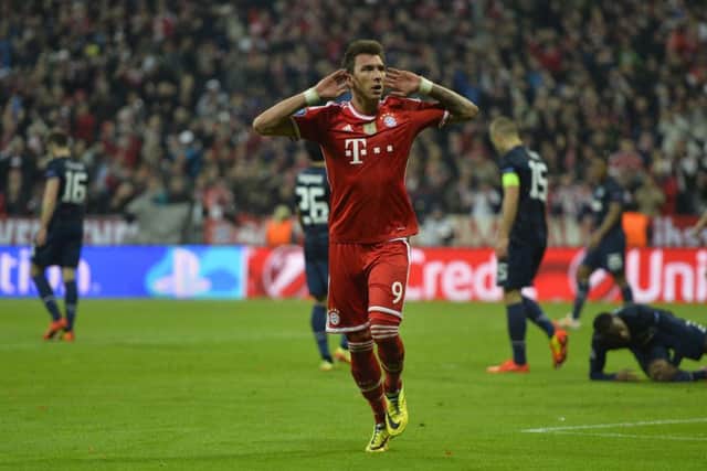 Bayern Munich's Croatian striker Mario Mandzukic celebrates his equaliser. Picture: Getty