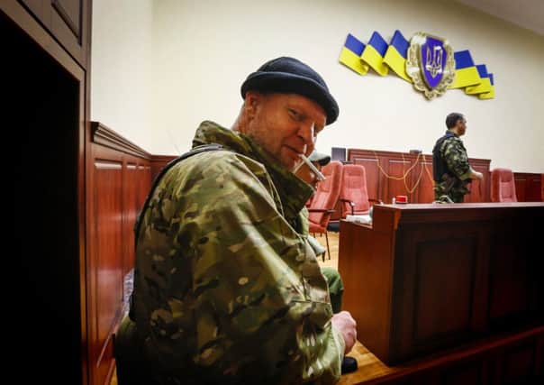 A pro-Russian in the security building in Luhansk. Picture: Reuters