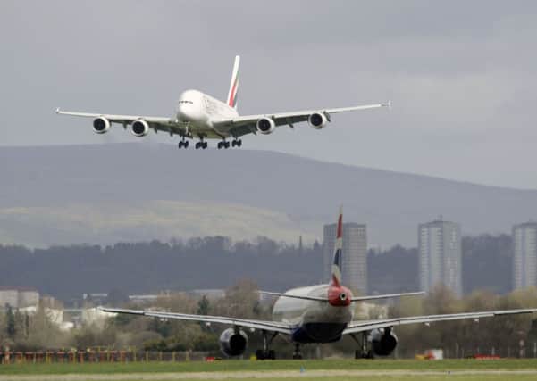The Airbus A380, known as the 'super jumbo', lands in Glasgow. Picture: John Devlin