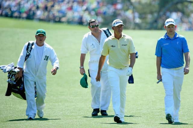 Stephen Gallacher, right, and Darren Clarke stride down the first fairway at Augusta National. Picture: Getty