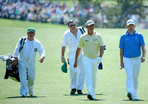 Stephen Gallacher, right, and Darren Clarke stride down the first fairway at Augusta National. Picture: Getty