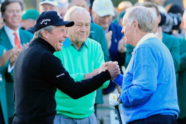Gary Player, Arnold Palmer and Jack Nicklaus greet each other on the first tee. Picture: Getty