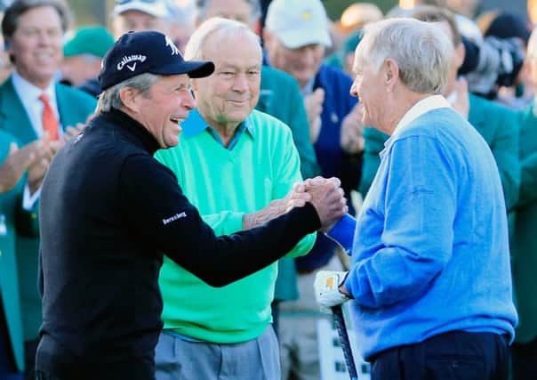 Gary Player, Arnold Palmer and Jack Nicklaus greet each other on the first tee. Picture: Getty