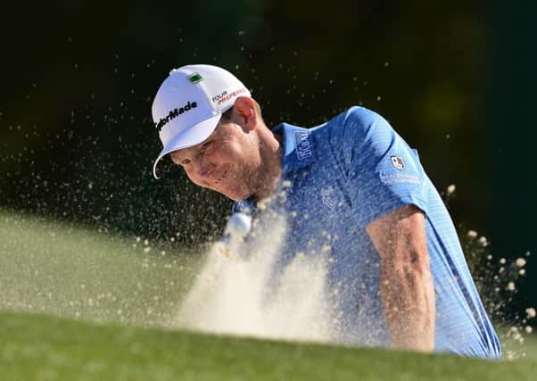 Stephen Gallacher plays a shot out of a bunker during the first round of the 78th Masters Golf Tournament at Augusta. Bill Haas of the US grabbed a one-stroke clubhouse lead over defending champion Adam Scott in the first round of the 78th Masters. Picture: Getty Images