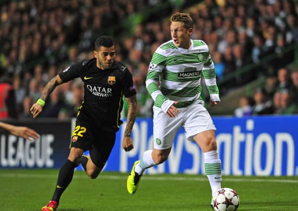 Celtic's Kris Commons takes on Barcelona's Dani Alves in October's game between the two sides. Picture: Robert Perry