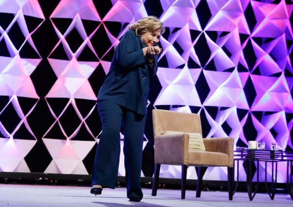 Hillary Clinton recoils to dodge the airborne shoe. Picture: Getty