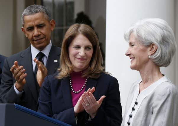 Mr Obama with Ms Sebelius, right, and Sylvia Matthews Burwell. Picture: AP
