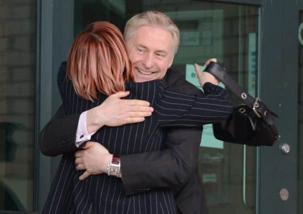 MP Nigel Evans hugged by former Coronation Street actress Vicky Entwistle outside court. Picture: Thomas Temple