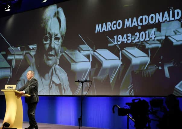 Scotland's First Minister Alex Salmond leads a round of applause for Margo MacDonald. Picture: Reuters