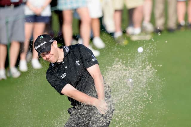 Stephen Gallacher plays out of a bunker at the second hole. Picture: Getty