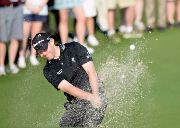 Stephen Gallacher plays out of a bunker at the second hole. Picture: Getty