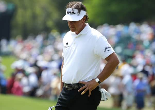 U.S. golfer Phil Mickelson reacts after a missed putt on the sixth hole. Picture: Reuters