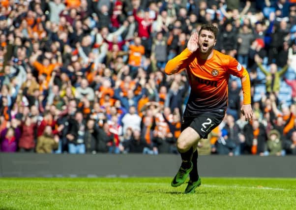 Nadir Ciftci celebrates after scoring his side's third goal of the game. Picture: SNS