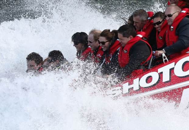 Prince William and his wife appeared to enjoy a jetboat ride along the Shotover River. Picture: Reuters