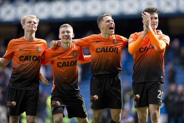 A jubilant John Rankin, second from right, celebrates with his Dundee United team-mates. Picture: SNS