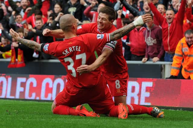 Martin Skrtel celebrates with skipper Steven Gerrard after scoring Liverpools second goal. Picture: Getty