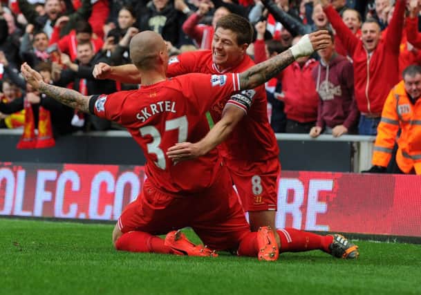 Martin Skrtel celebrates with skipper Steven Gerrard after scoring Liverpools second goal. Picture: Getty