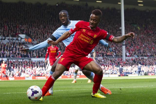 Raheem Sterling, right, keeps the ball from Manchester City's Yaya Toure. Picture: AP