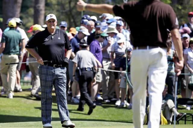 Miguel Angel Jimenez gives Sandy Lyle a thumbs-up after Lyle's birdie on the sixth. Picture: AP