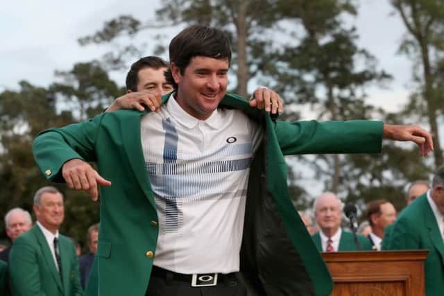 Adam Scott presents Bubba Watson of the United States with the Green Jacket. Picture: Getty
