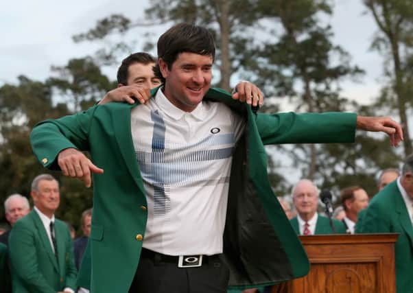 Adam Scott presents Bubba Watson of the United States with the Green Jacket. Picture: Getty
