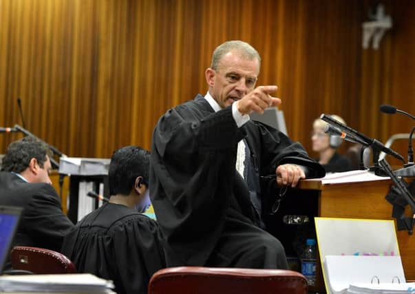 State prosecutor Gerrie Nel questions Oscar Pistorius during cross examination today. Picture: Getty
