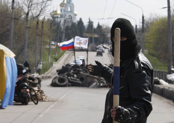 A pro-Russia militiaman guards a barricade near the eastern Ukrainian city of Slavyansk. Picture: Getty