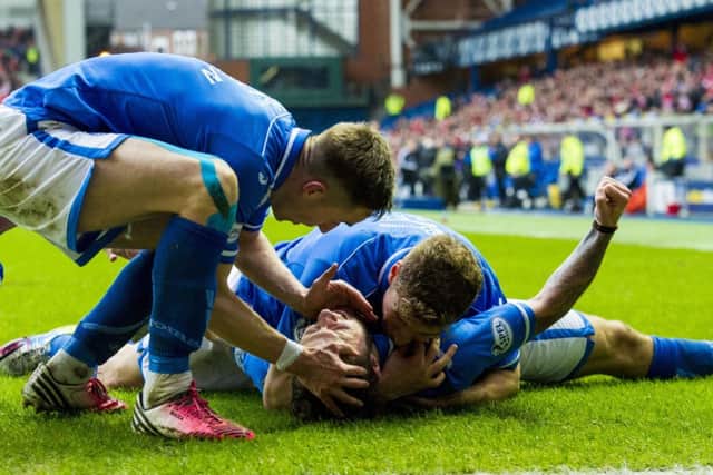 St Johnstone hero Stevie May is mobbed by his team-mates after scoring the equaliser. Picture: SNS