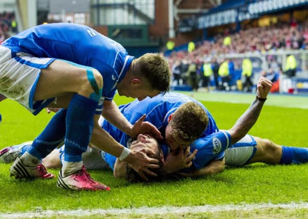 St Johnstone hero Stevie May is mobbed by his team-mates after scoring the equaliser. Picture: SNS