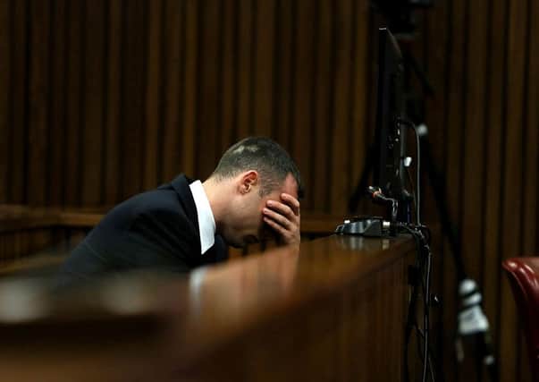 Oscar Pistorius listens to evidence in the Pretoria High Court on April 15, 2014, in Pretoria, South Africa. Picture: Getty