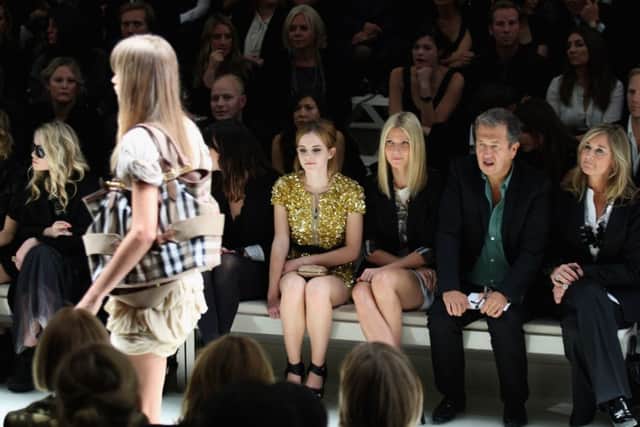 Angela Ahrendts at a show with, from left, Emma Watson, Gwyneth Paltrow and Mario Testino. Picture: Getty