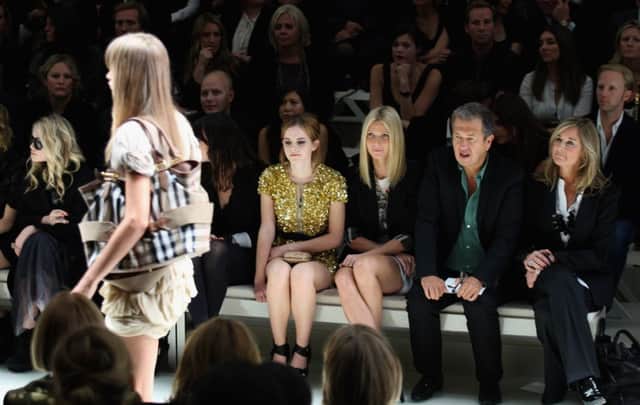Angela Ahrendts at a show with, from left, Emma Watson, Gwyneth Paltrow and Mario Testino. Picture: Getty