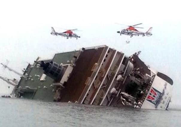 Rescue helicopters fly over the sinking South Korean passenger ferry. Picture: AP