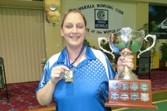 Caroline Brown with the trophy after becoming the first female Scot to win the World Cup Singles event