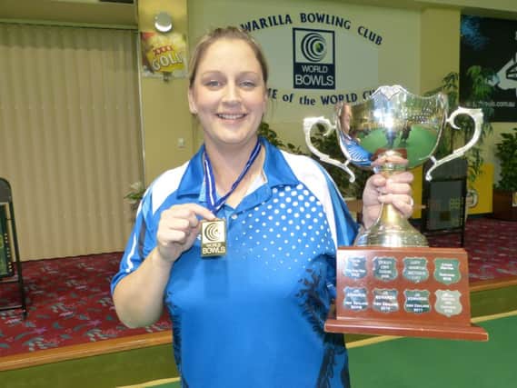 Caroline Brown with the trophy after becoming the first female Scot to win the World Cup Singles event