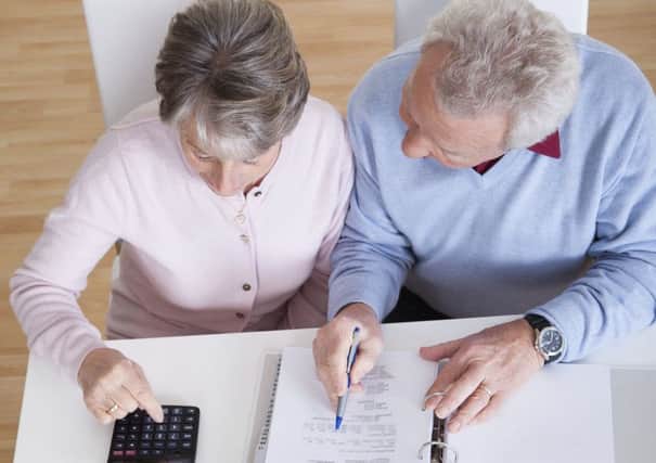 Senior Couple Calculating Budget