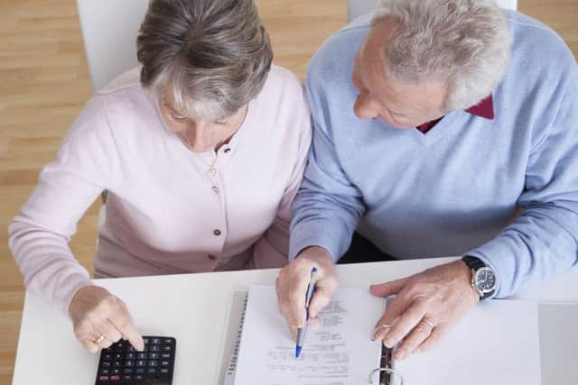Senior Couple Calculating Budget