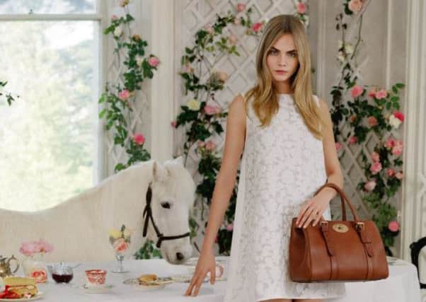 A Mulberry model poses with one of their signature bags. Picture: Contributed