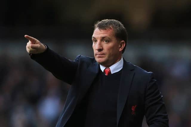 Brendan Rodgers Liverpool have the momentum in the title race after ten consecutive wins. Picture: PA