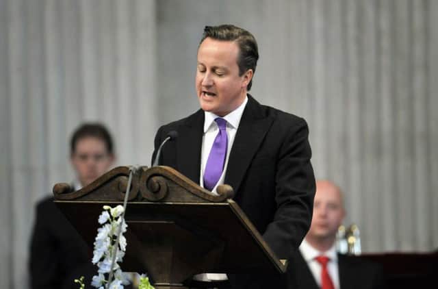 David Cameron reads during the service of thanksgiving to mark the Queen's Diamond Jubilee. Picture: Getty