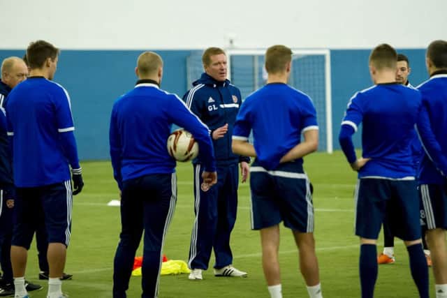Hearts manager Gary Locke speaks with his squad during training. Picture: SNS