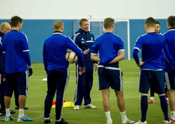Hearts manager Gary Locke speaks with his squad during training. Picture: SNS