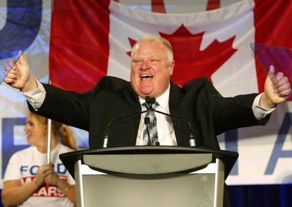 The embattled rightleaning mayor of Toronto, Rob Ford, reacts to applause during his campaign launch party. Picture: Reuters